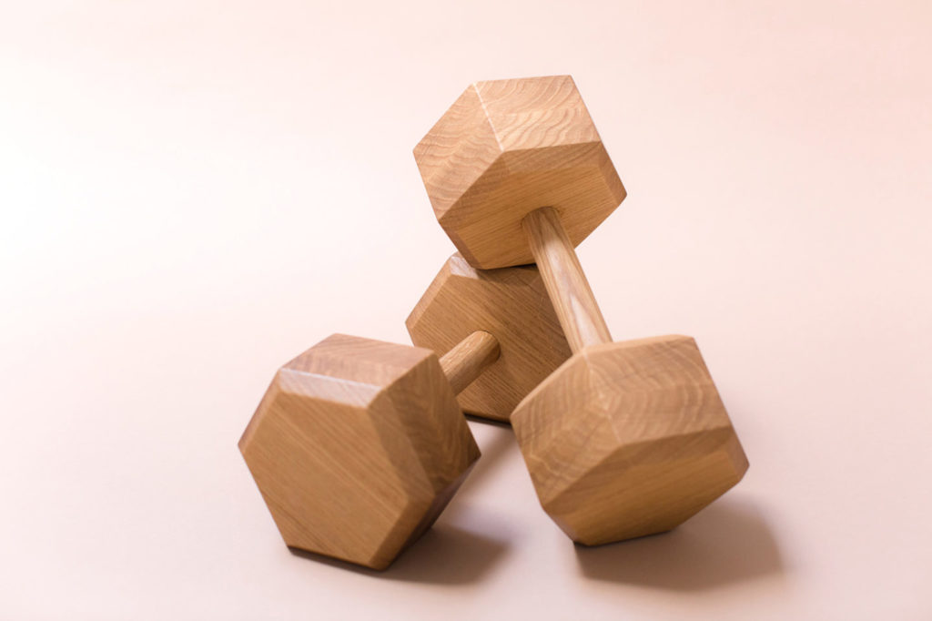 Free weights made of wood designed by Asa Pingree part of Tidewalker workout set.