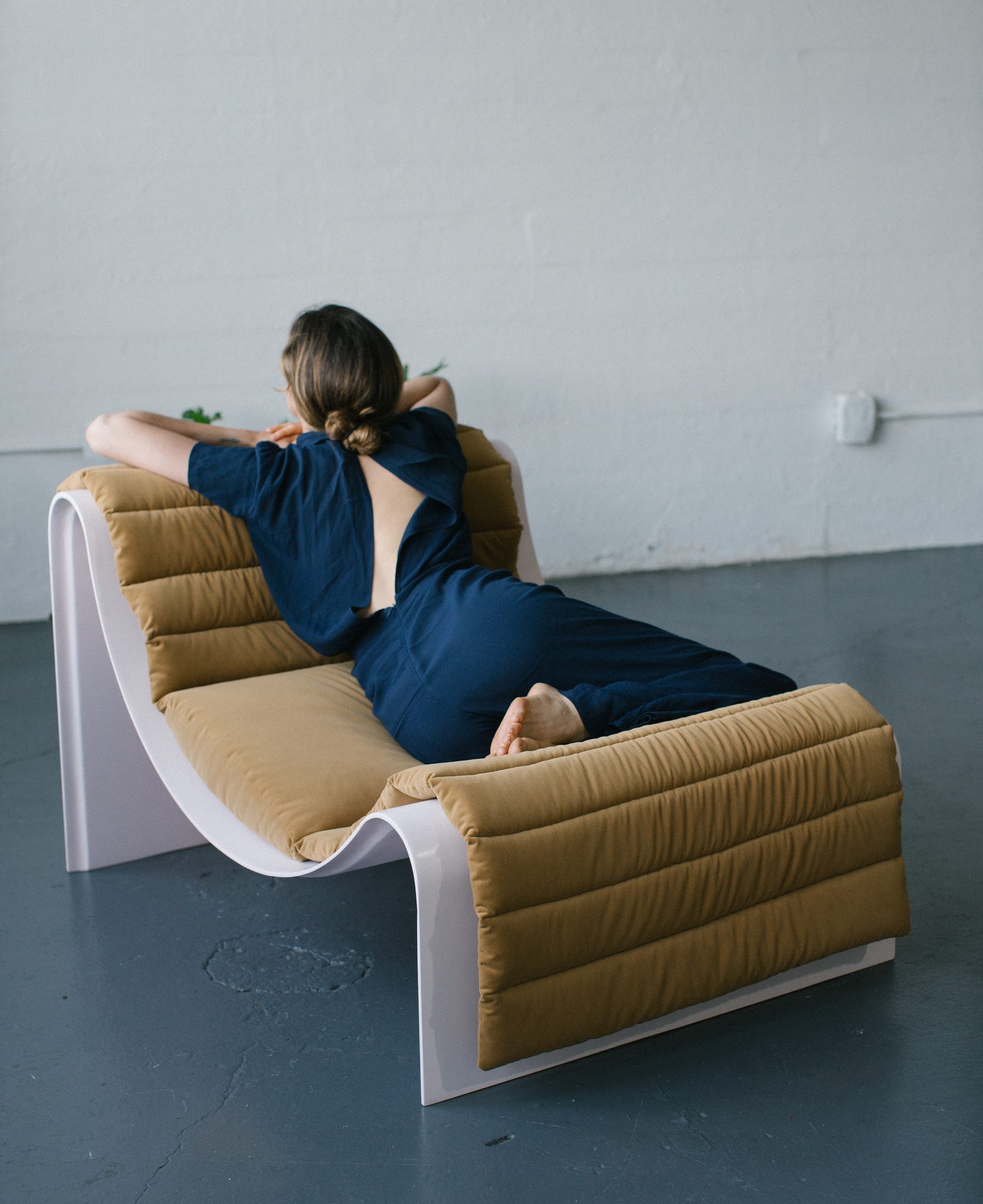 This is a Fiberglass Lounge Chair in pink for Indoor-Outdoor use designed by Asa Pingree and called the Knockabout.