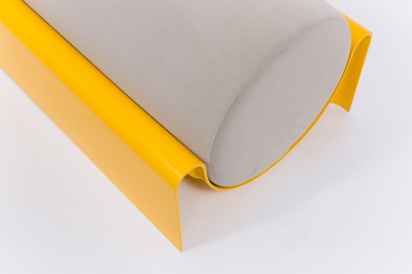 Bench in fiberglass with a cylindrical cushion for Indoor-Outdoor use designed by Asa Pingree