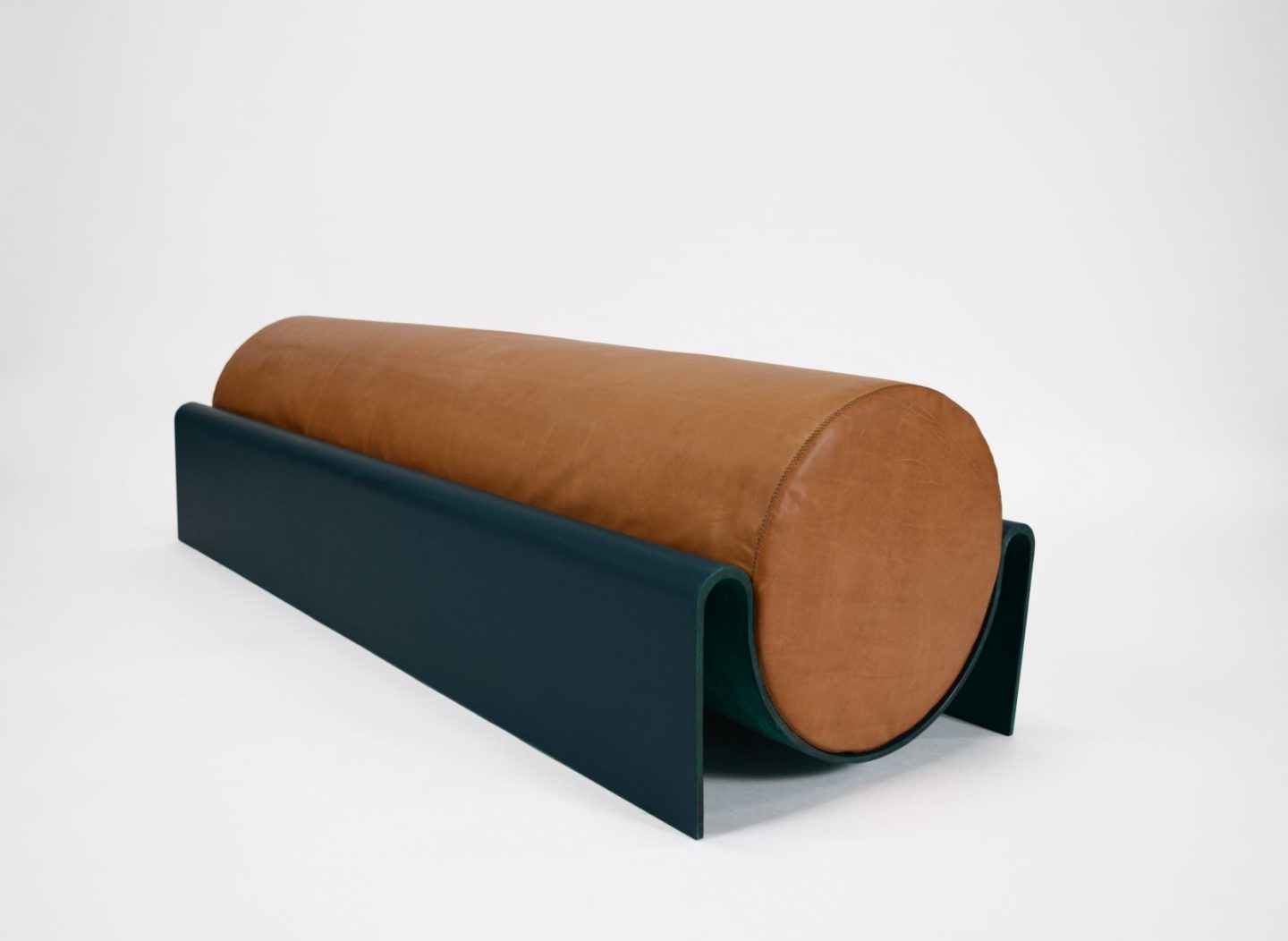 Bench in fiberglass with a cylindrical leather cushion designed by Asa Pingree